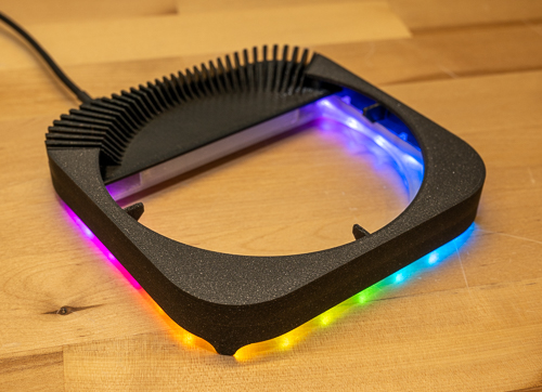 The empty Blinkenhub stand with its LEDs lit, showing the open center and rear cooling fins